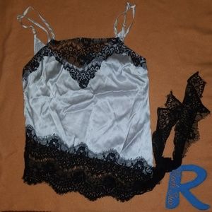 Nwot Bebe Ladies size xsmall cami silky shirt.